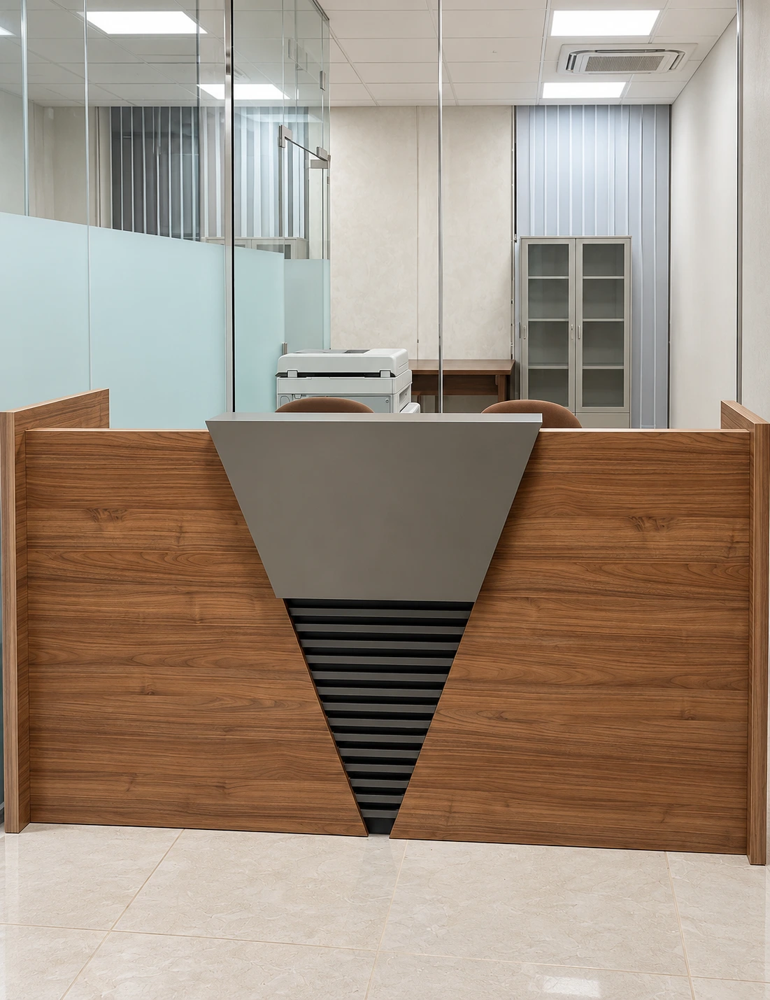 Walnut-finish reception counter with grey front feature installed in Salalah